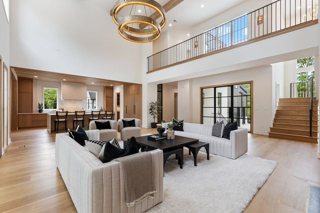 a living room with fireplace furniture and a window