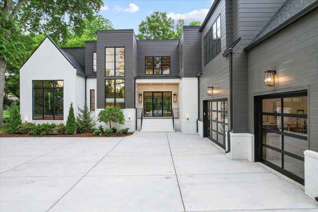 front view of a brick house with a large window
