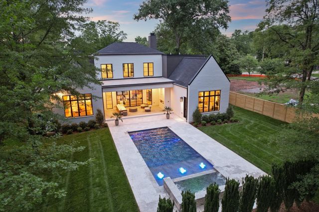 an aerial view of house with yard