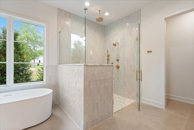 a view of an empty room with a cabinet and a window