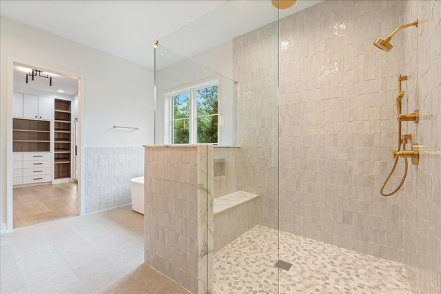 a living room with furniture cabinets and a fireplace