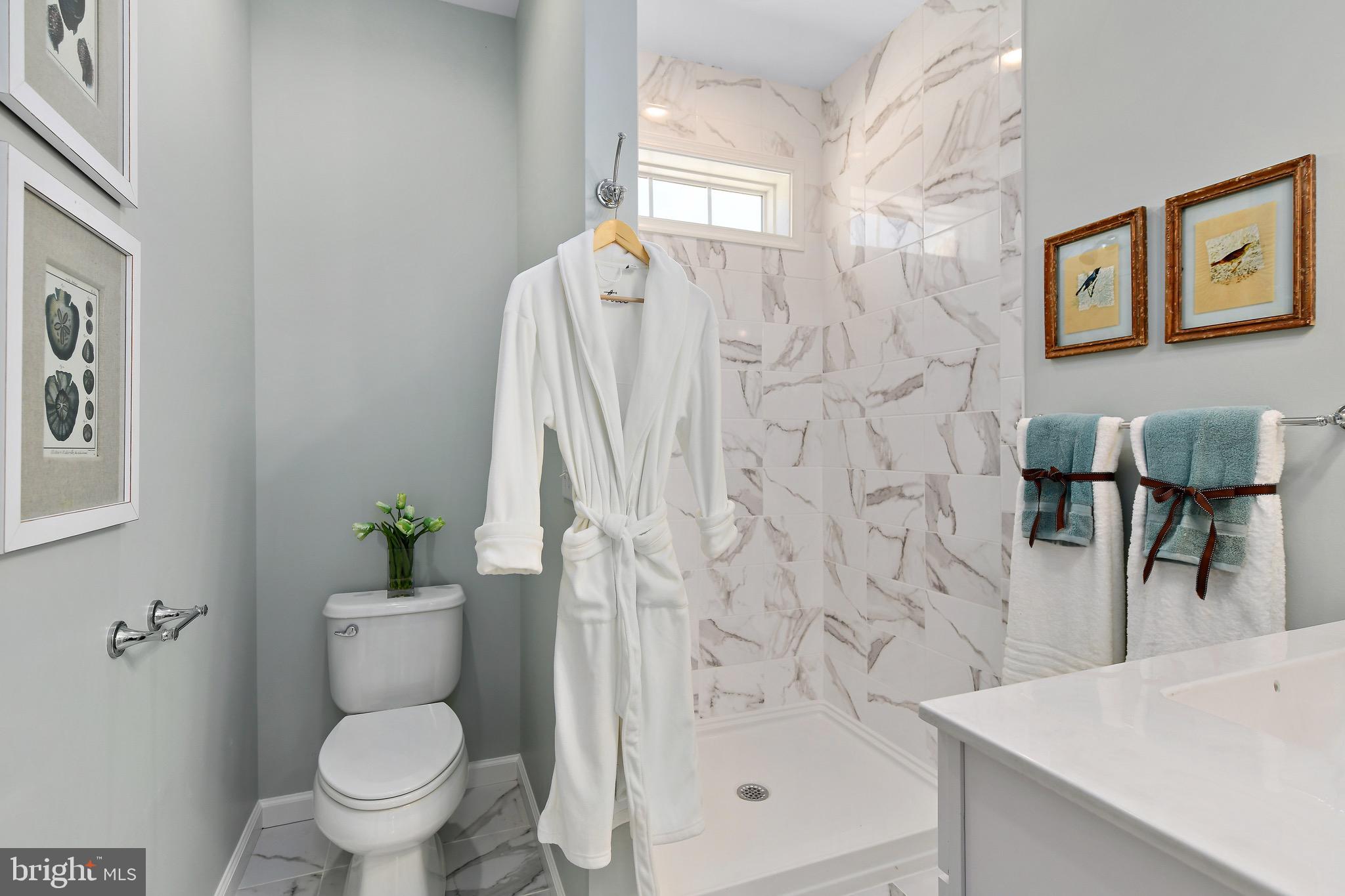 31307 Point Reyes Lane, Unit 16 Ocean View, DE 19970 - Photo 28 of 50 tile shower and flooring