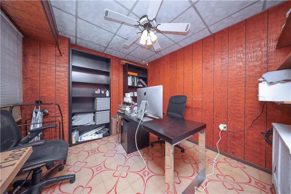 a workspace with furniture and chandelier