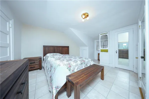 a bedroom with a bed and dresser