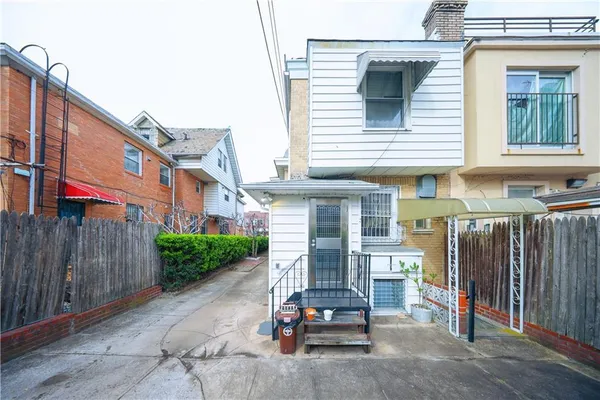 a view of a chair and tables in the patio