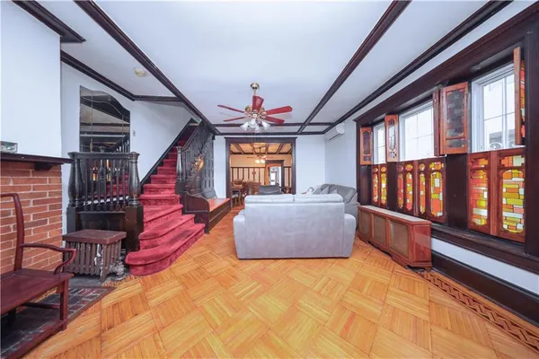 a living room with furniture fireplace and rug