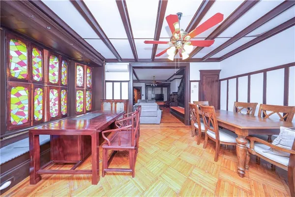 a view of a dining room with furniture window and outside view