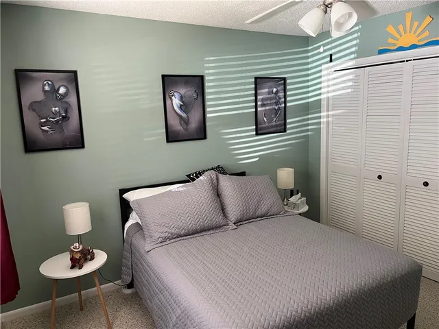 a bedroom with a bed and a couch