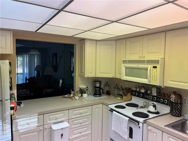 a kitchen with a stove and a refrigerator