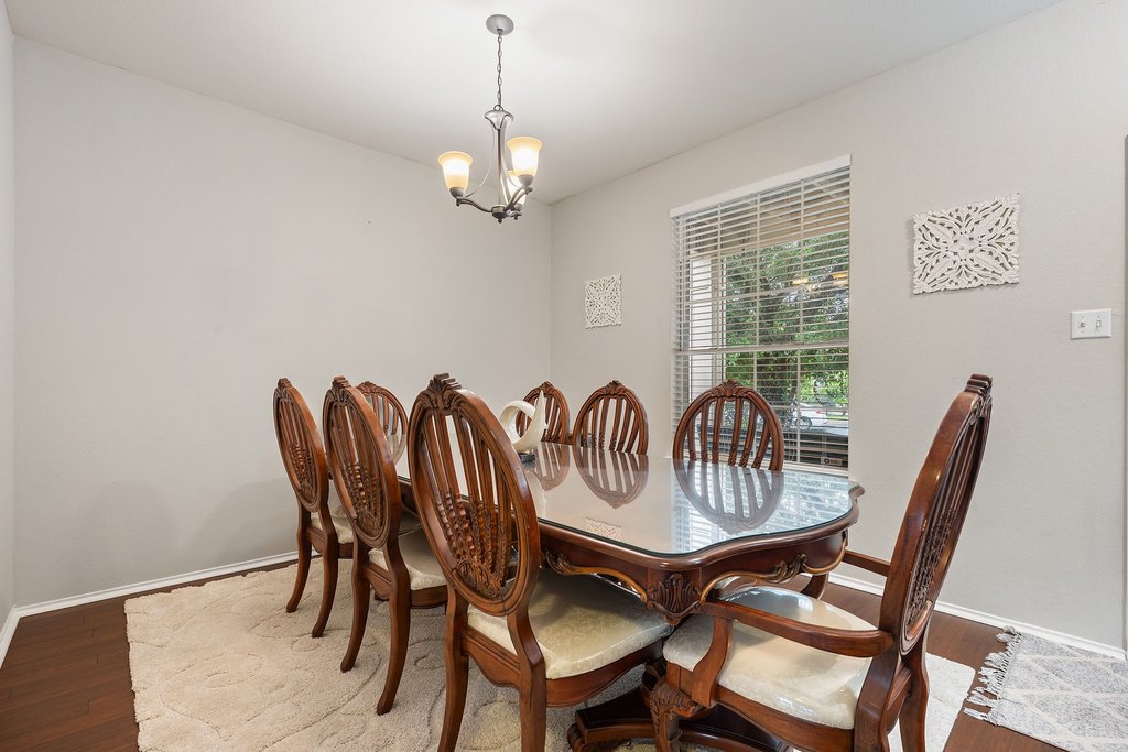 140 Wolfberry Path Buda, TX 78610 - Photo 19 of 35 a view of a dining room with furniture window and outside view