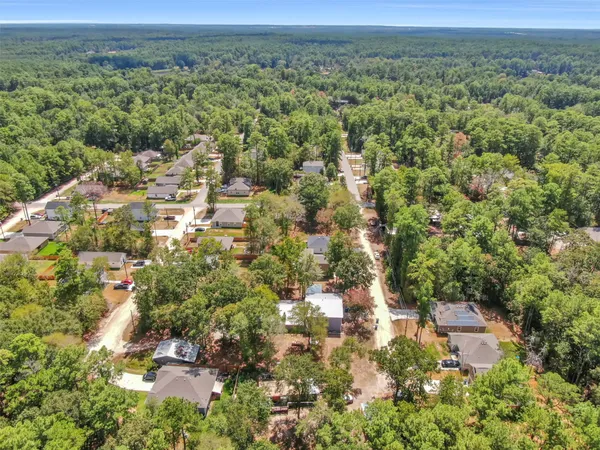 an aerial view of a house with outdoor space