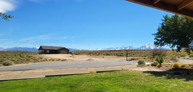 a view of a yard with an ocean view