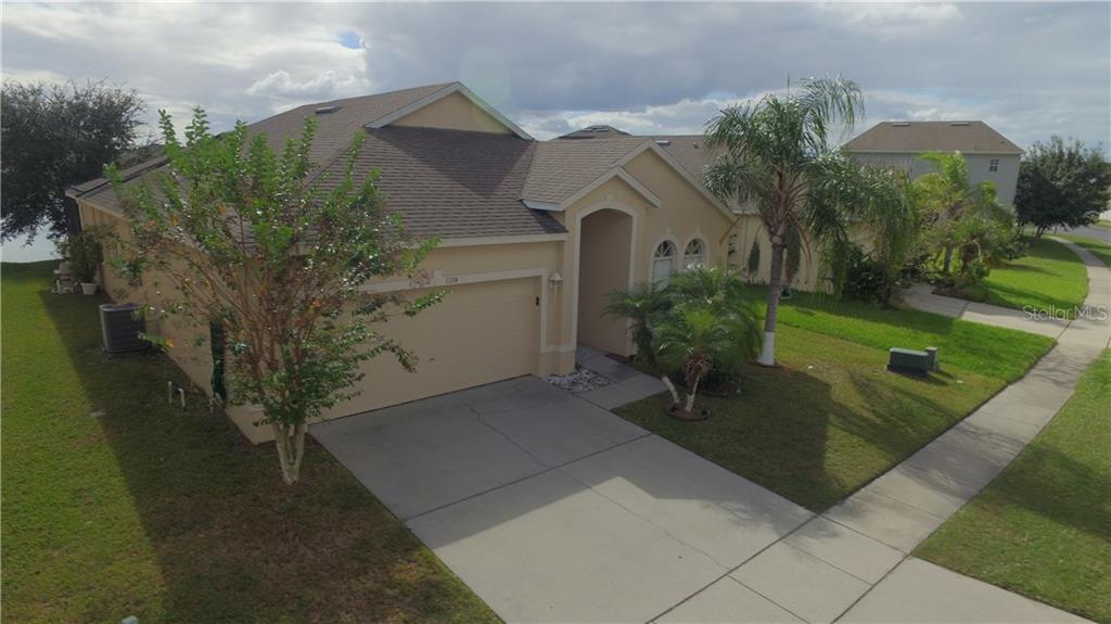 1174 Darnaby Way Orlando, FL 32824 - Photo 1 of 1 a view of a house with a yard