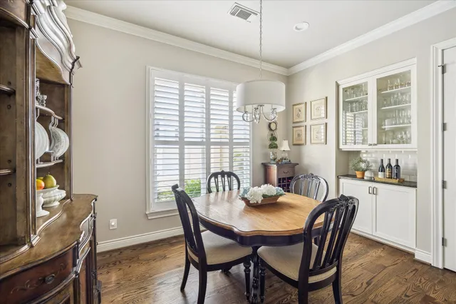 a kitchen with stainless steel appliances granite countertop a stove and a center island with wooden floor