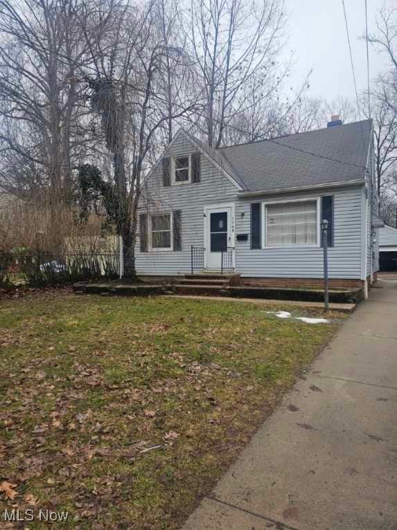 1149 Dorsh Road Cleveland, OH 44121 - Photo 1 of 11 Bungalow with a chimney and a front lawn
