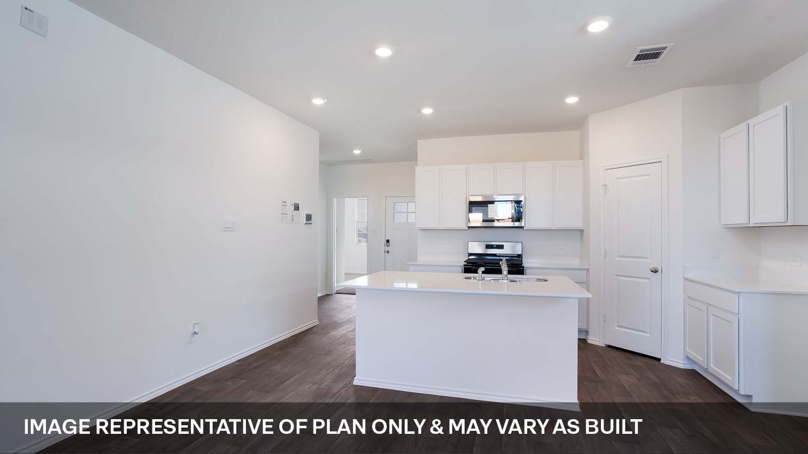 1165 Celosia Loop Kyle, TX 78640 - Photo 5 of 18 a room with kitchen island a sink and wooden floor