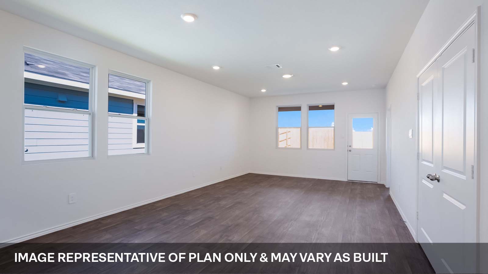 1165 Celosia Loop Kyle, TX 78640 - Photo 8 of 18 an empty room with wooden floor and windows