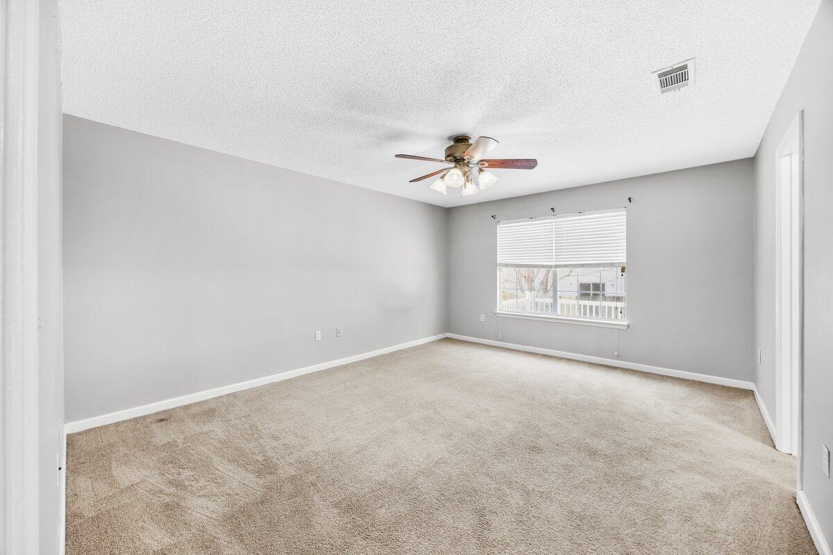 439 Northview Lane Crestview, FL 32536 - Photo 13 of 32 an empty room with a empty space and windows