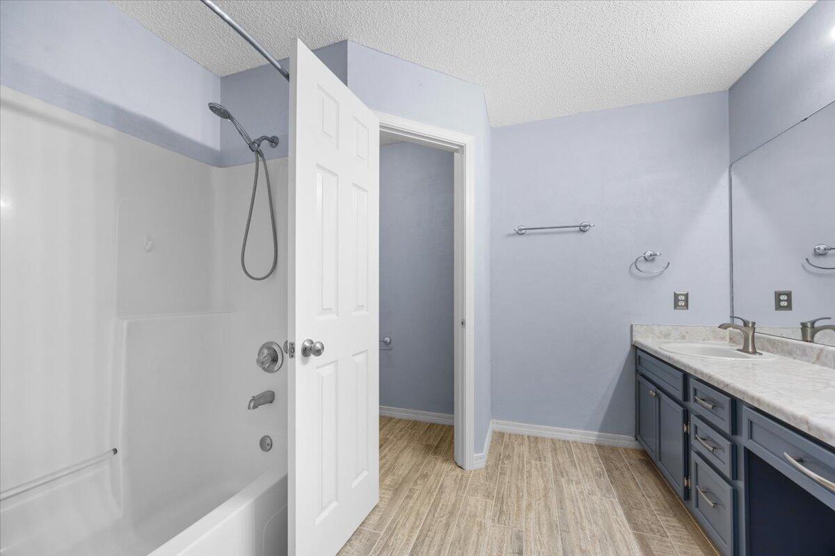 439 Northview Lane Crestview, FL 32536 - Photo 15 of 32 a bathroom with a granite countertop shower a sink and a shower