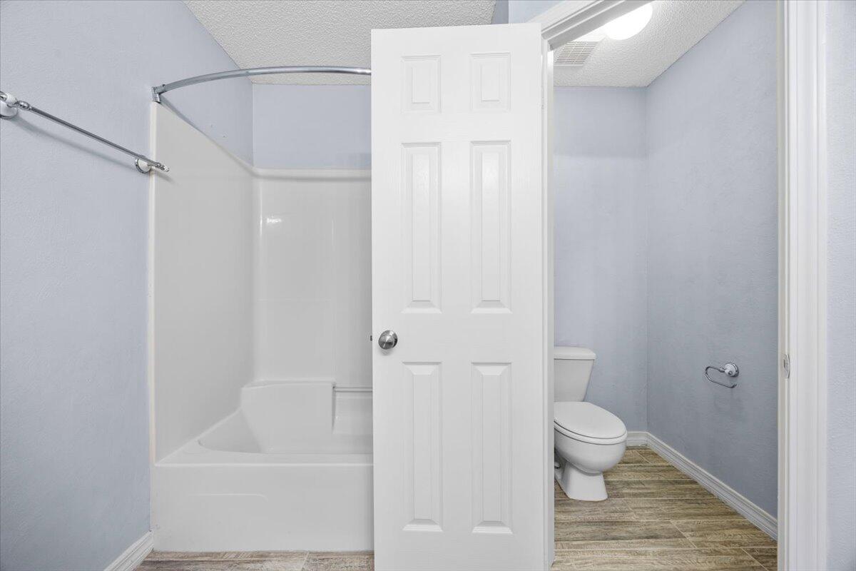 439 Northview Lane Crestview, FL 32536 - Photo 18 of 32 a bathroom with a toilet and a shower