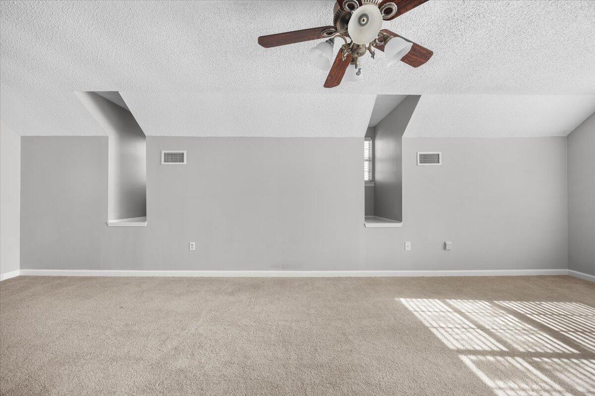 439 Northview Lane Crestview, FL 32536 - Photo 24 of 32 a view of a room with stairs and a ceiling fan