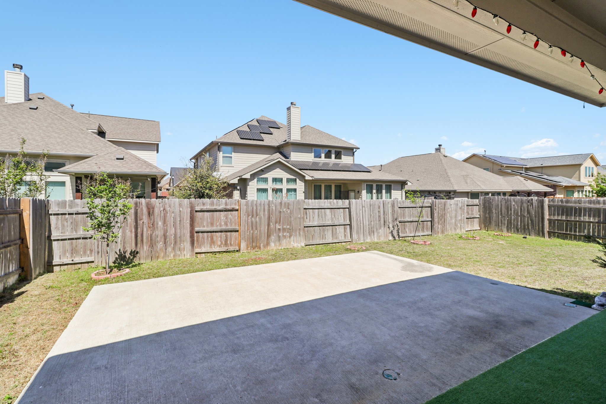 3816 Bow Perch Street Pflugerville, TX 78660 - Photo 16 of 23 a view of an house with backyard and a garden