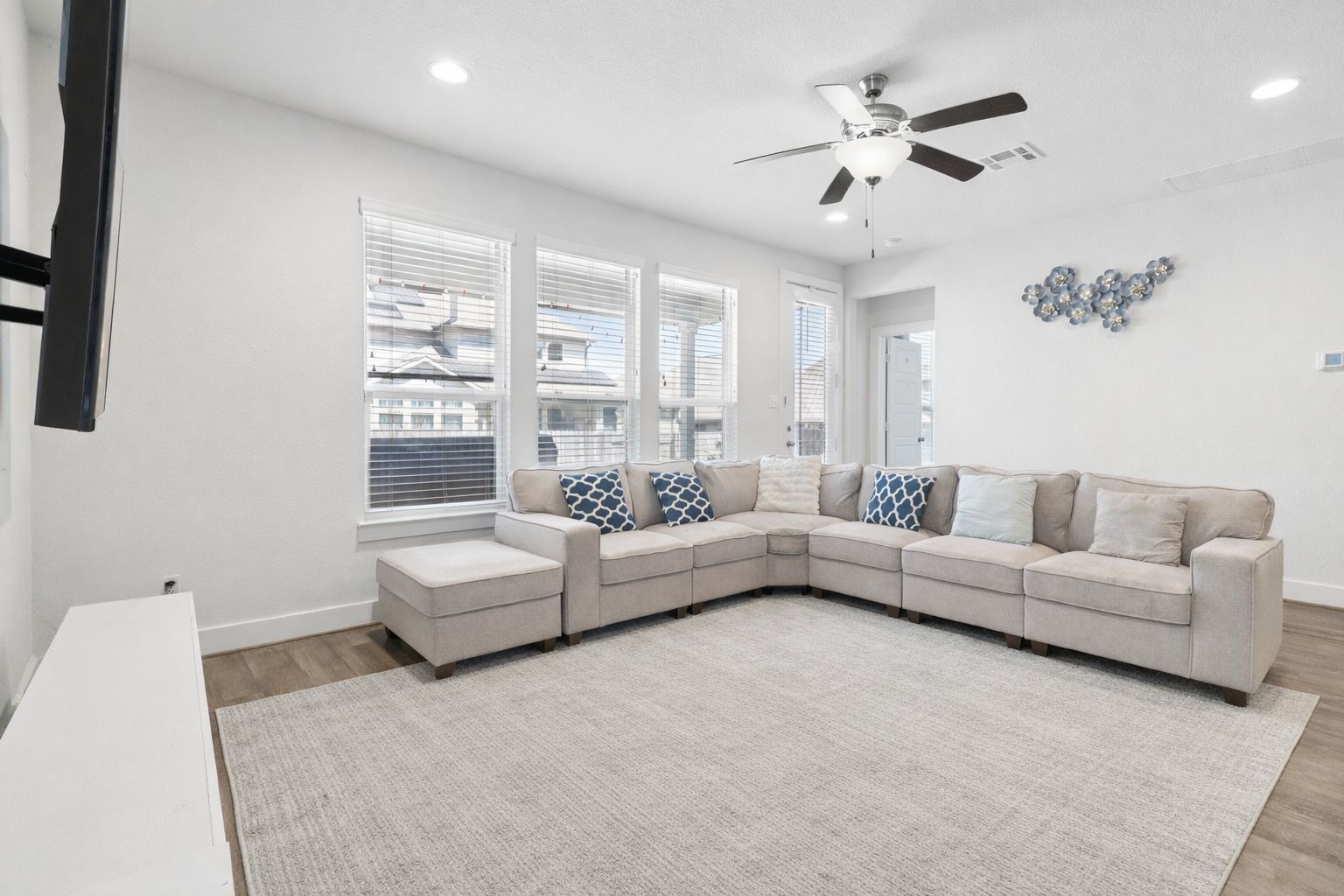 3816 Bow Perch Street Pflugerville, TX 78660 - Photo 3 of 23 a living room with furniture and a chandelier