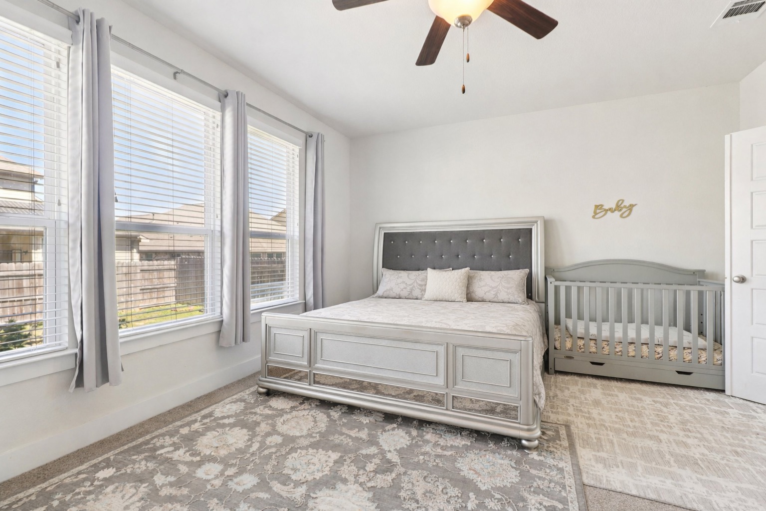3816 Bow Perch Street Pflugerville, TX 78660 - Photo 7 of 23 a bedroom with a bed and a large window