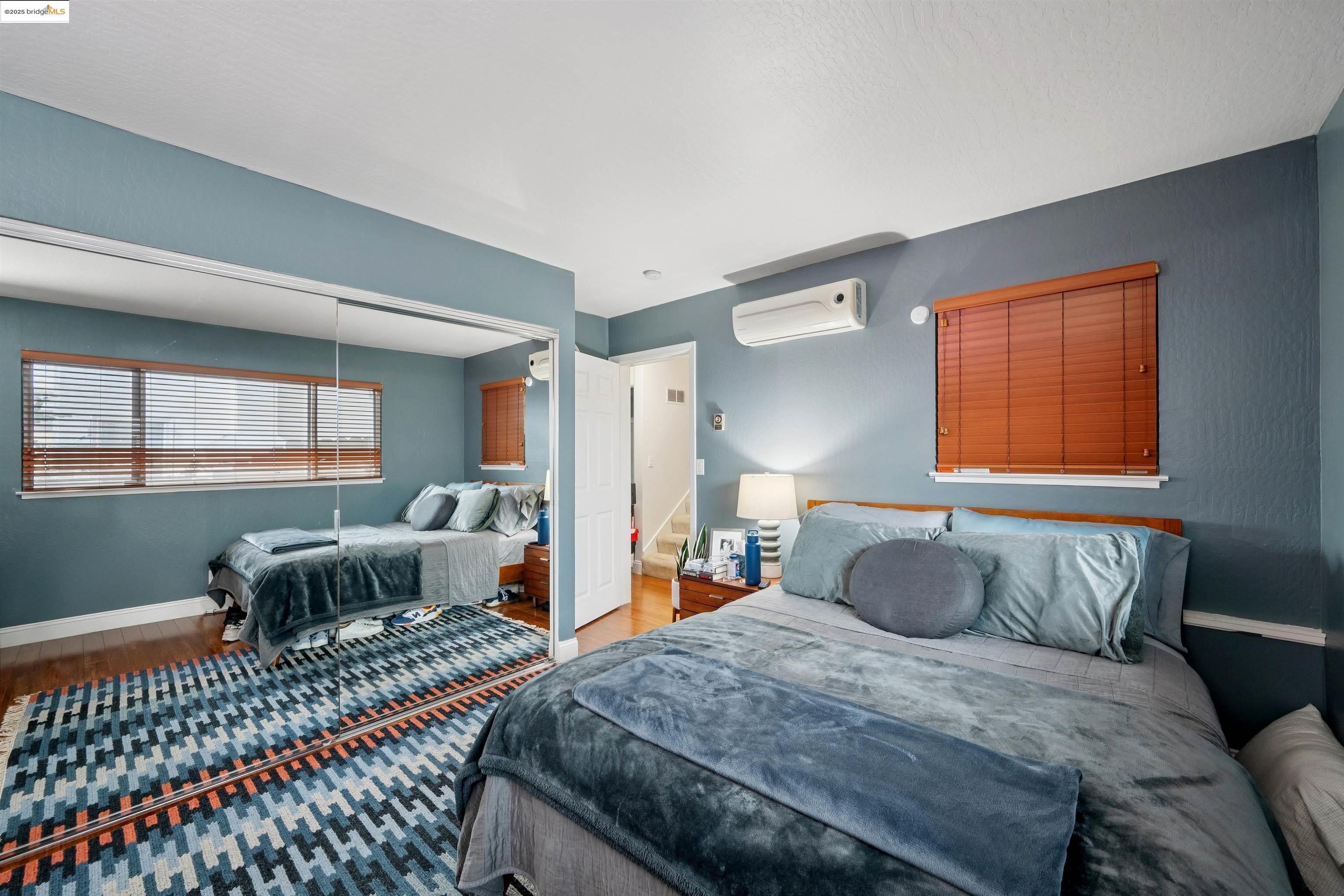 2980 Park Boulevard, Unit 1 Oakland, CA 94610 - Photo 8 of 10 a bedroom with furniture a bed and a window