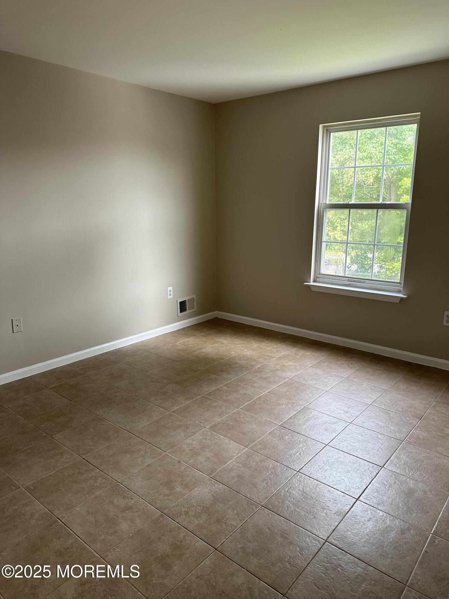 13 Fountain Avenue, Unit A Matawan, NJ 07747 - Photo 11 of 13 an empty room with a window