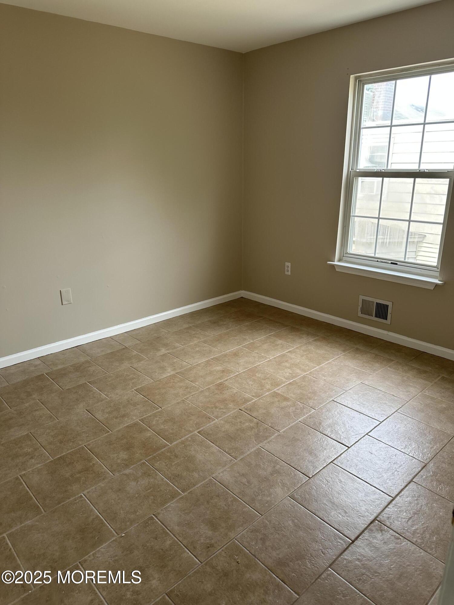 13 Fountain Avenue, Unit A Matawan, NJ 07747 - Photo 12 of 13 an empty room with a empty space and a window