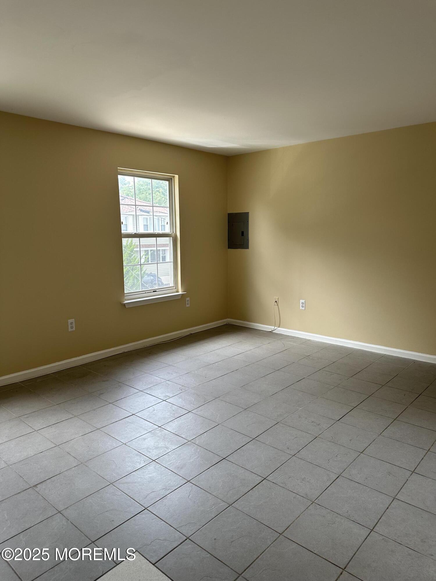 13 Fountain Avenue, Unit A Matawan, NJ 07747 - Photo 4 of 13 an empty room with windows