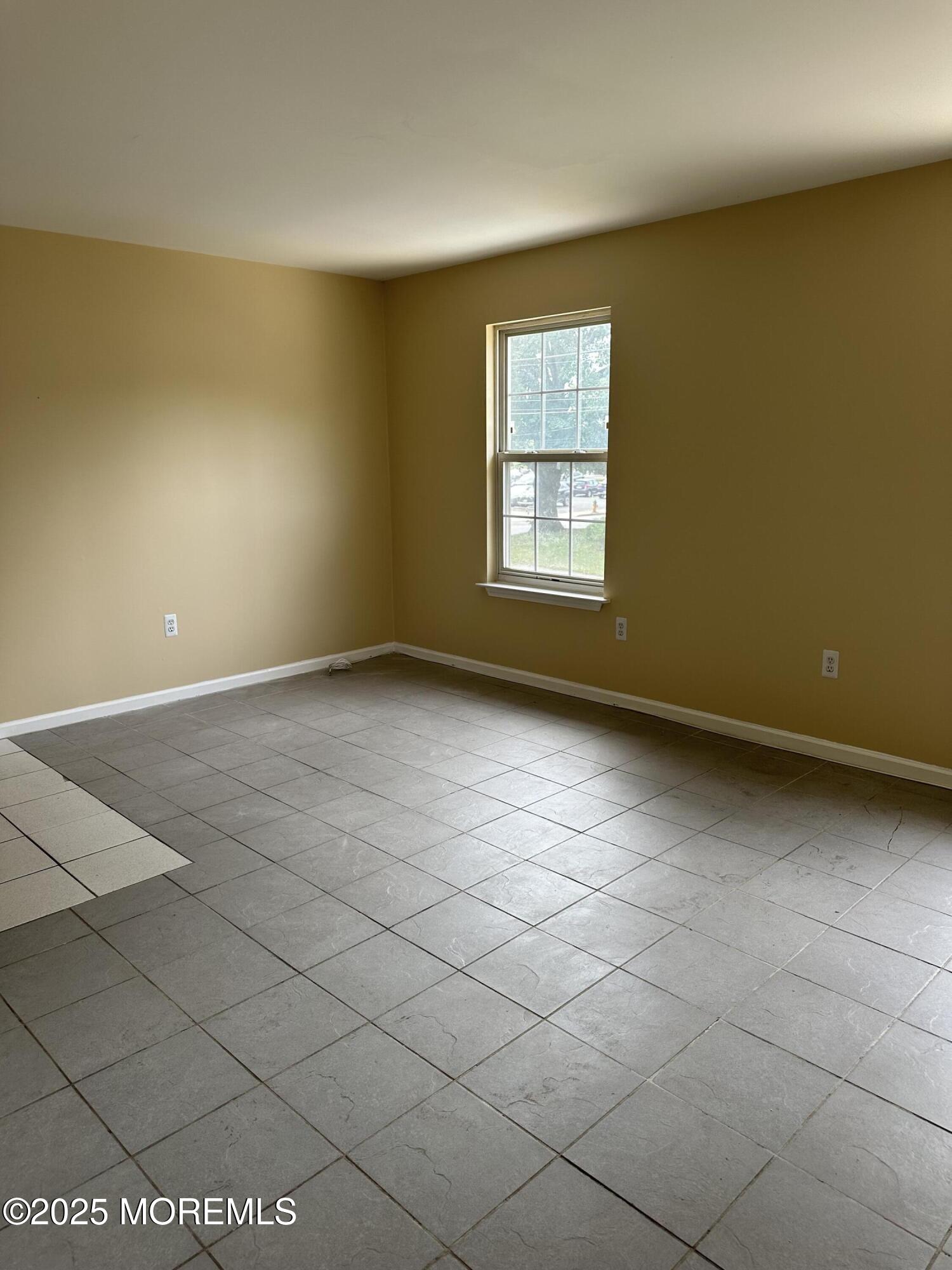 13 Fountain Avenue, Unit A Matawan, NJ 07747 - Photo 5 of 13 a view of an empty room with a window