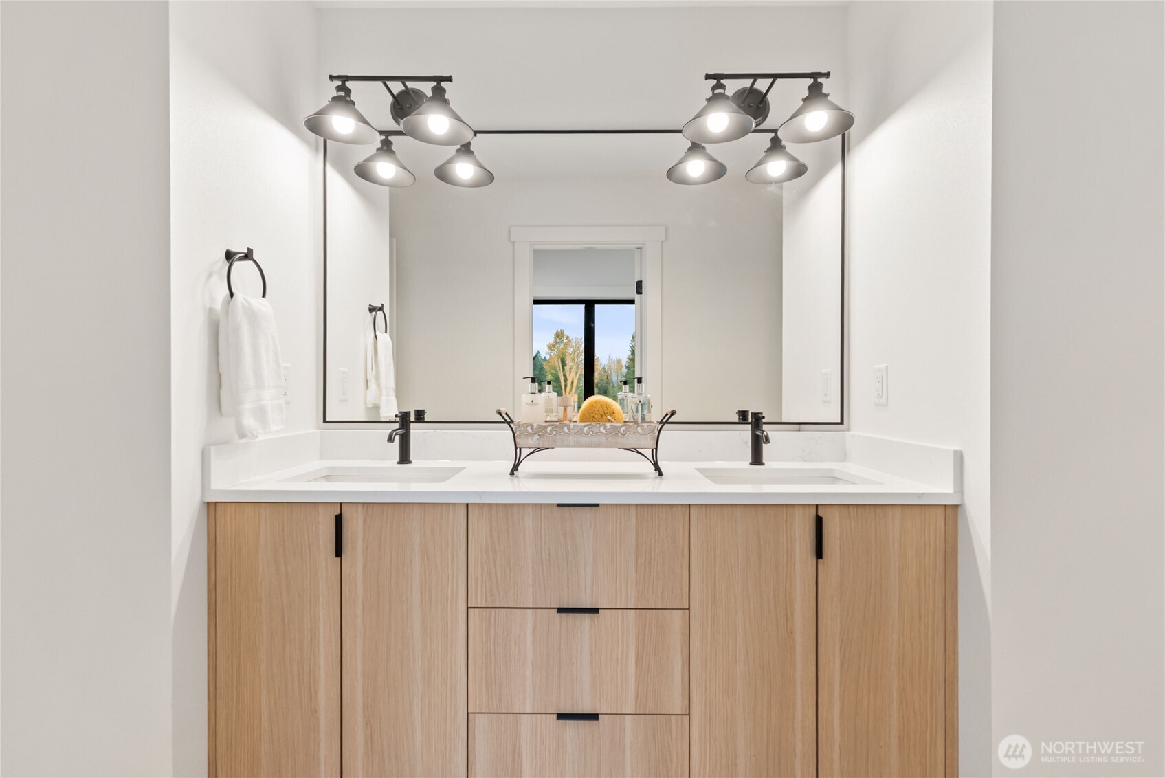 15809 239th Street East Graham, WA 98338 - Photo 24 of 40 a bathroom with a double vanity sink and a mirror