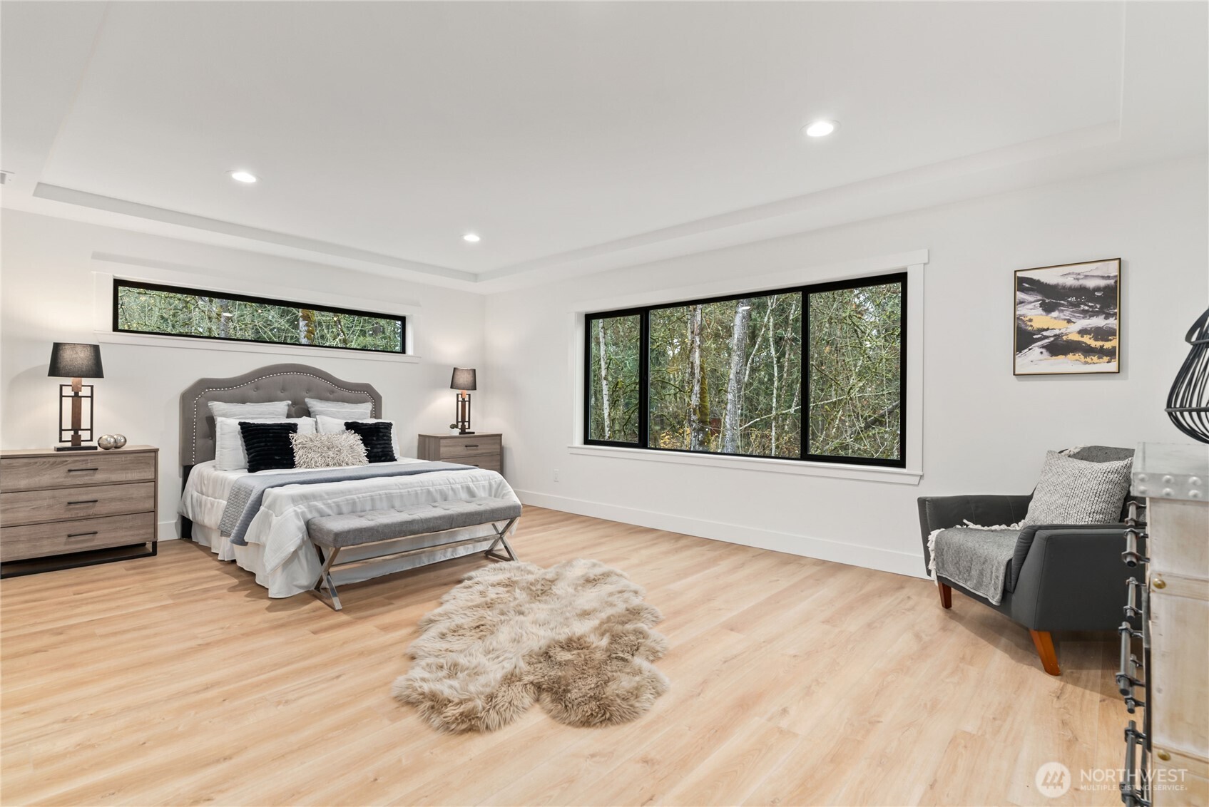 15809 239th Street East Graham, WA 98338 - Photo 27 of 40 a spacious bedroom with a large bed and a large window