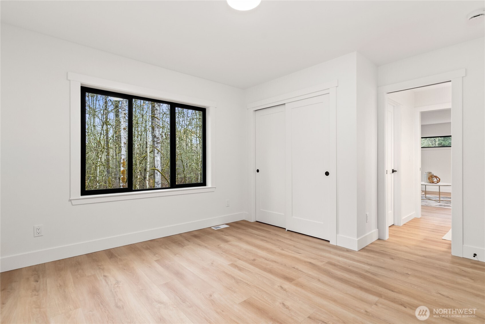 15809 239th Street East Graham, WA 98338 - Photo 34 of 40 a view of an empty room with wooden floor and a window