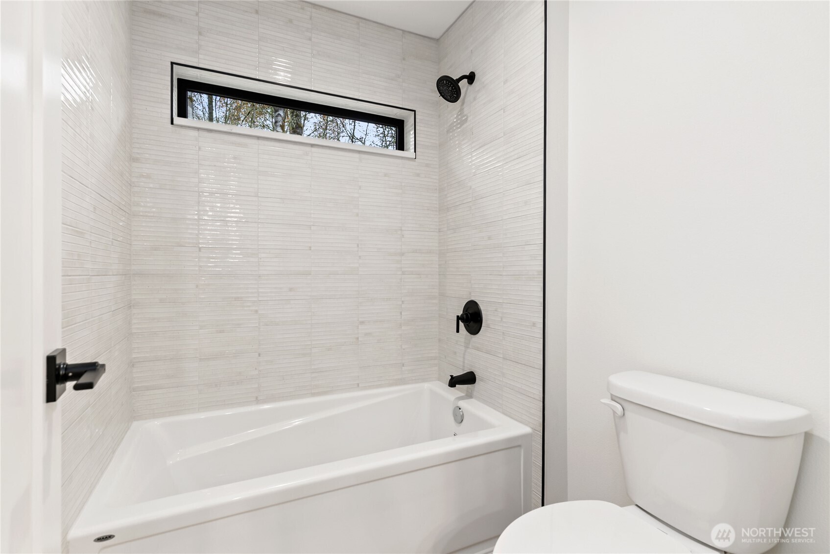 15809 239th Street East Graham, WA 98338 - Photo 35 of 40 a bathroom with a toilet and a bathtub