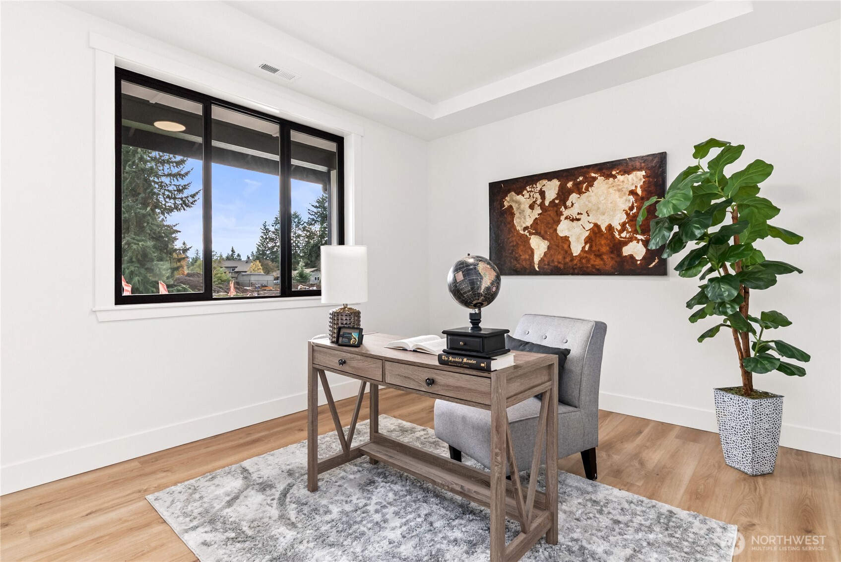 15809 239th Street East Graham, WA 98338 - Photo 7 of 40 a living room with furniture a potted plant and a window