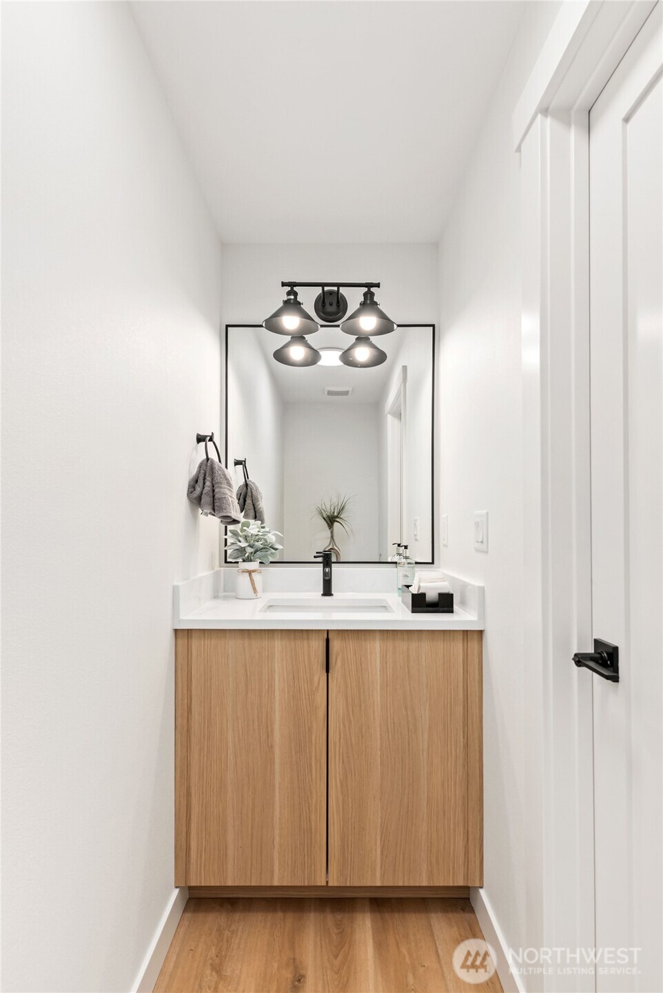 15809 239th Street East Graham, WA 98338 - Photo 8 of 40 a bathroom with a sink and a mirror