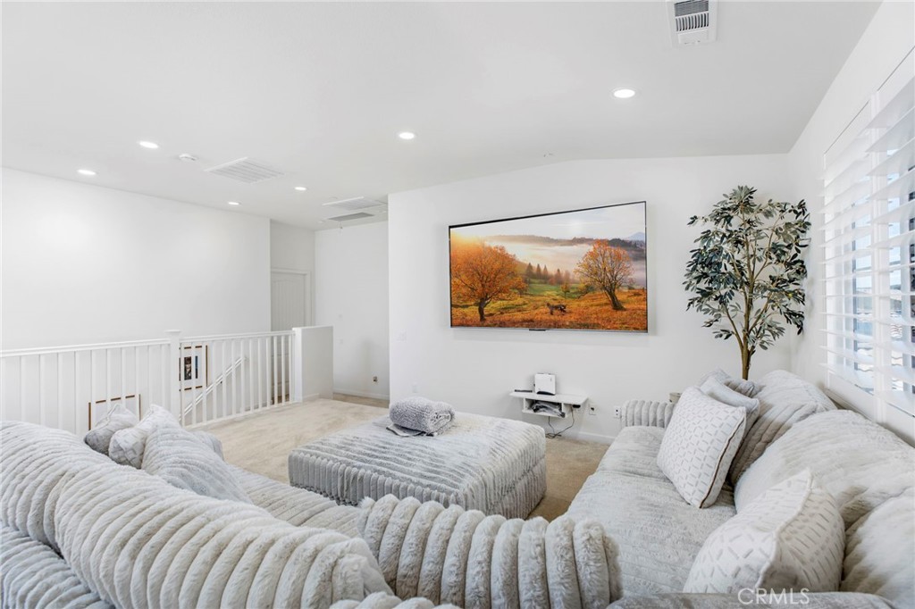 32797 Hayden Road Menifee, CA 92584 - Photo 22 of 51 a living room with furniture and a large mirror