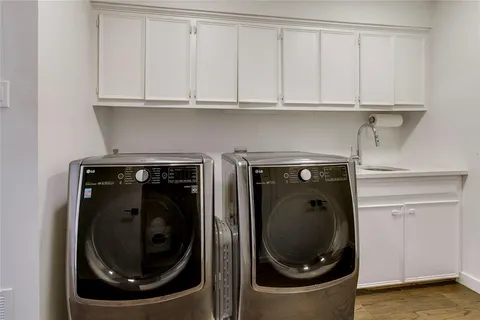a close view of a utility room with washer and dryer