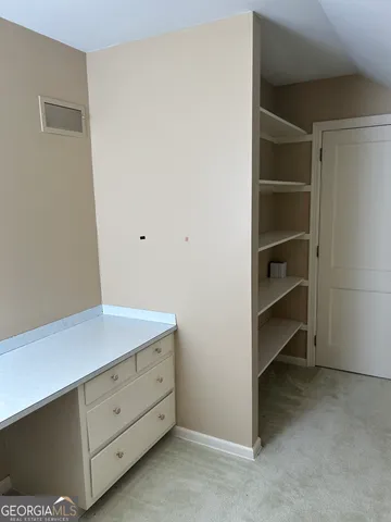 a living room with furniture a fireplace and a wooden floor