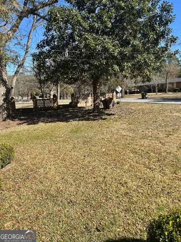 a view of empty room with a fireplace