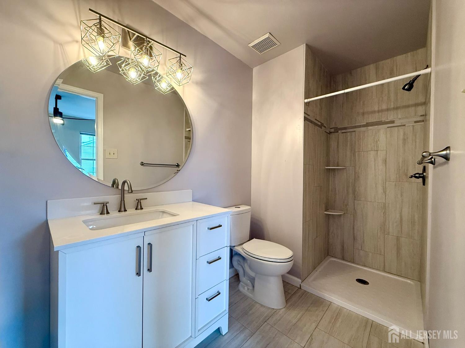 384 Inwood Court Somerset, NJ 08873 - Photo 23 of 29 a bathroom with a sink a toilet and shower