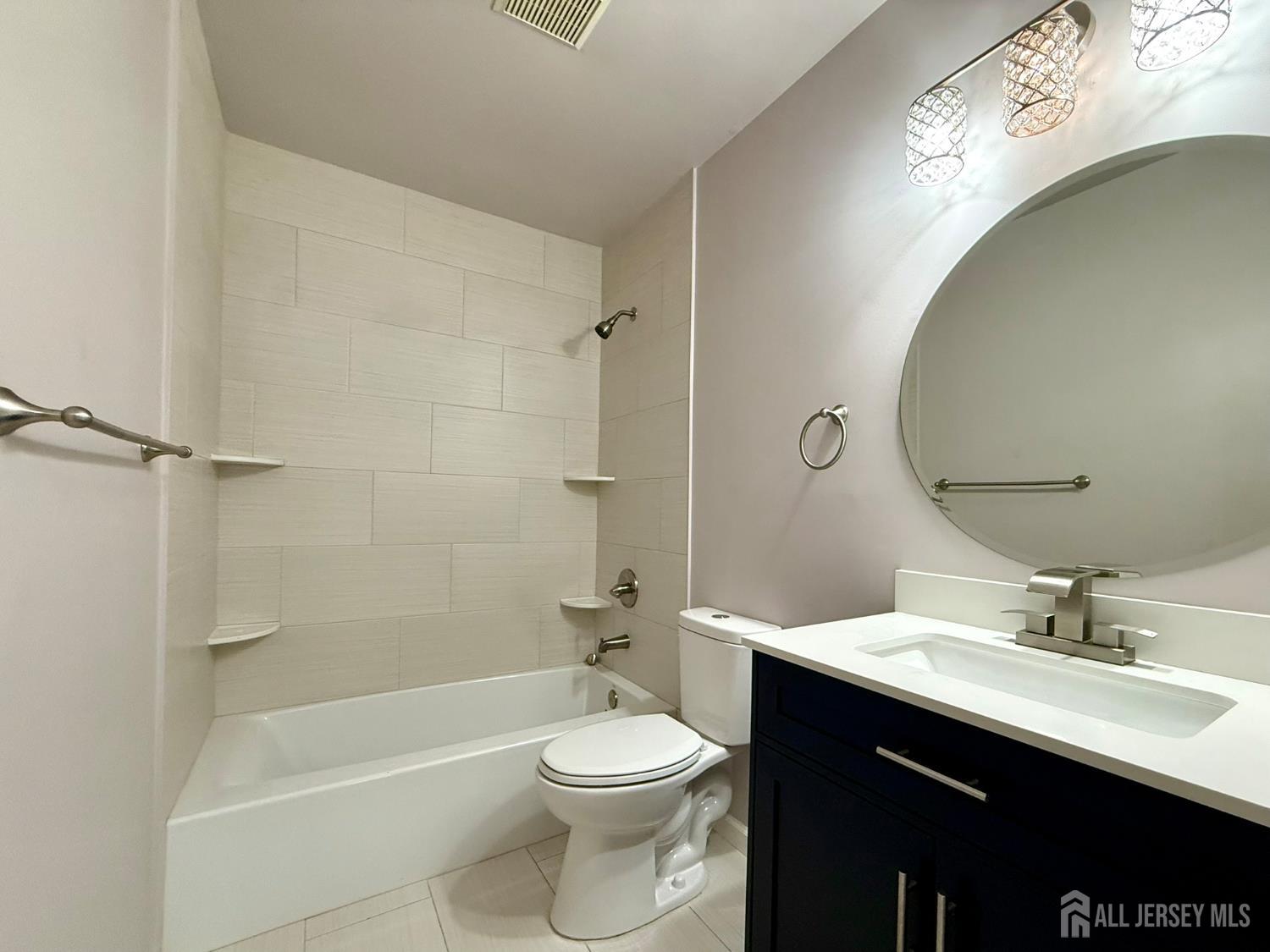 384 Inwood Court Somerset, NJ 08873 - Photo 26 of 29 a bathroom with a sink a toilet and shower