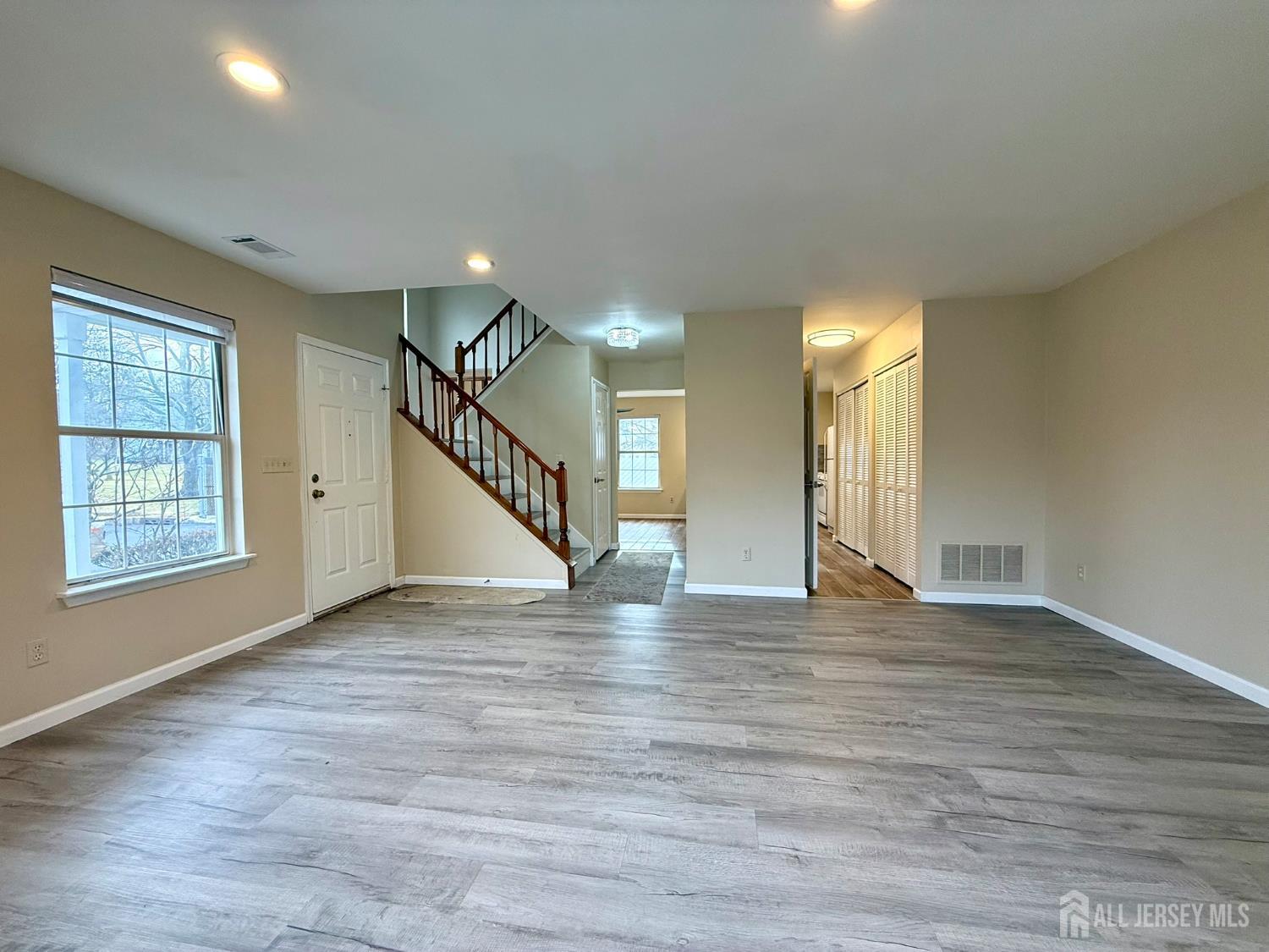384 Inwood Court Somerset, NJ 08873 - Photo 6 of 29 a view of empty room with wooden floor and fan