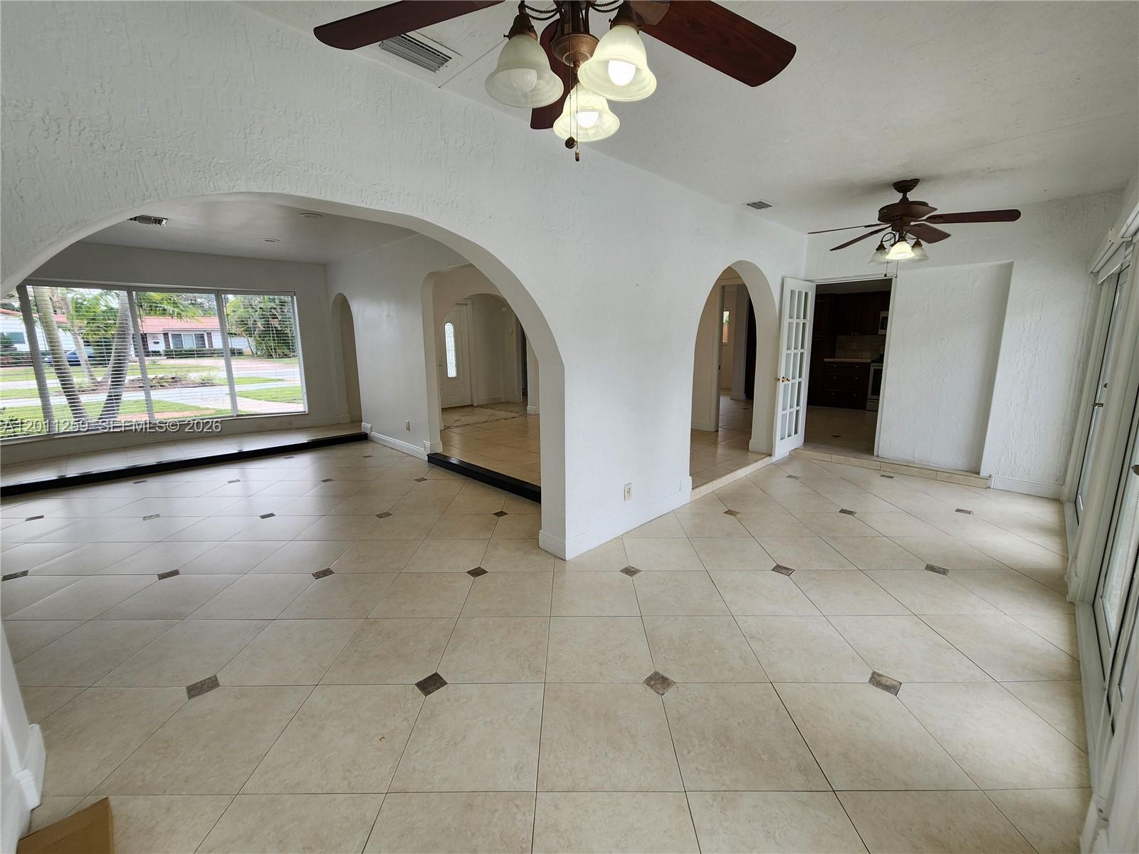 4233 Jackson Street Hollywood, FL 33021 - Photo 13 of 28 a view of a livingroom with a chandelier