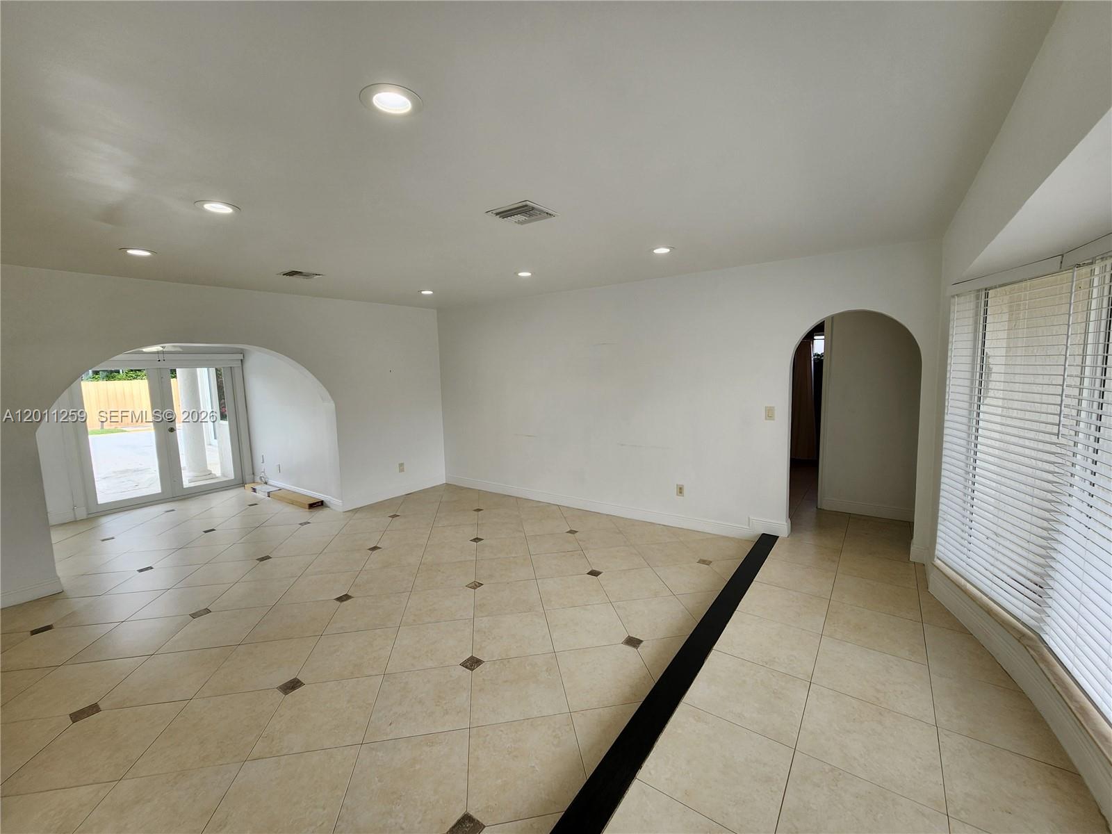4233 Jackson Street Hollywood, FL 33021 - Photo 17 of 28 a view of a hallway with a bathroom