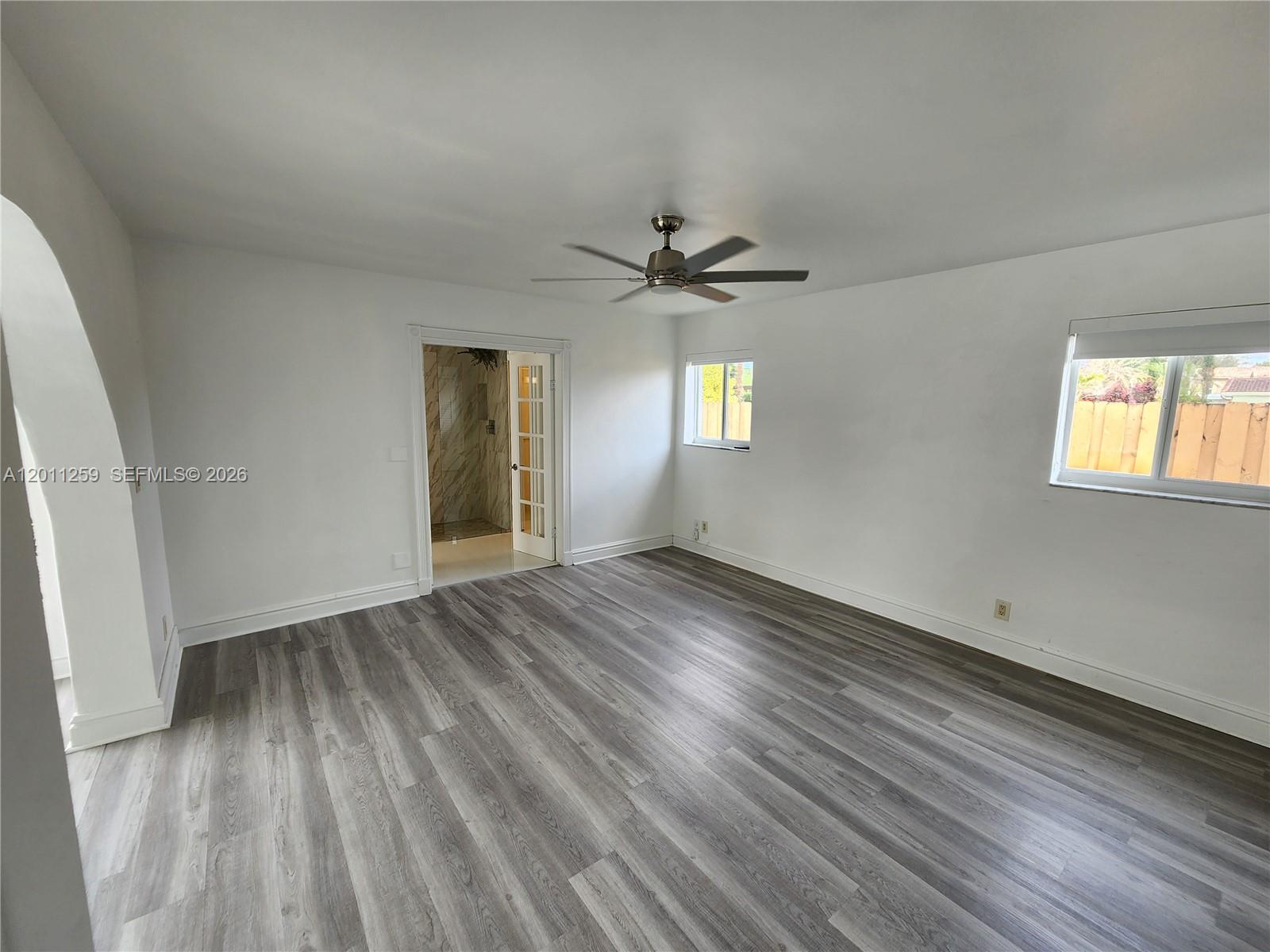4233 Jackson Street Hollywood, FL 33021 - Photo 23 of 28 wooden floor in an empty room with a window