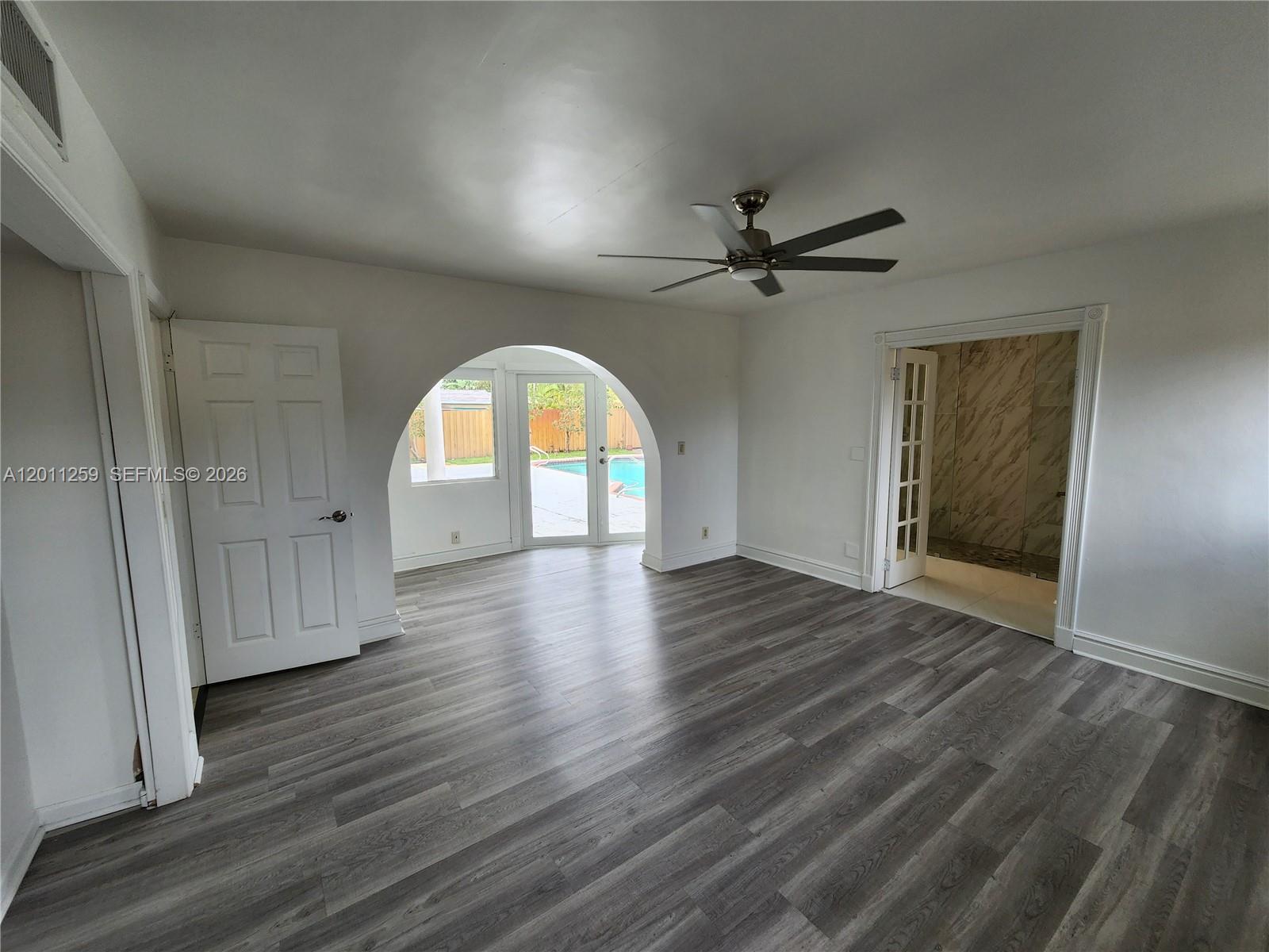4233 Jackson Street Hollywood, FL 33021 - Photo 24 of 28 wooden floor in an empty room with a window